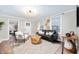 Bright living room features contemporary furnishings, stylish decor, and plenty of natural light at 413 E Caven St, Indianapolis, IN 46225