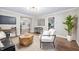Comfortable living room offering stylish decor, open layout, and seamless flow to the kitchen at 413 E Caven St, Indianapolis, IN 46225