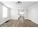 Spacious living room features sleek flooring, neutral walls, and updated lighting fixtures at 413 E Caven St, Indianapolis, IN 46225