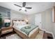 Beautiful bedroom with a ceiling fan, natural light, and stylish decor at 413 E Caven St, Indianapolis, IN 46225