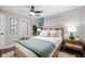 Cozy bedroom with stylish decor, soft lighting, and hardwood floors at 413 E Caven St, Indianapolis, IN 46225