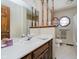 Bathroom features decorative wallpaper, wooden decorative dividers, large vanity, sink and a toilet at 450 W 250 N, Lebanon, IN 46052