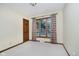 Bedroom features a window view, natural light, neutral walls, carpeted floor and wood trim at 450 W 250 N, Lebanon, IN 46052