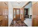 Inviting entryway boasts a tile floor and natural light shining through the front door's window at 450 W 250 N, Lebanon, IN 46052