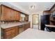 Kitchen with stainless appliances, wood cabinets, tile backsplash, and eat-in peninsula at 450 W 250 N, Lebanon, IN 46052