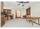 Open living space with carpet, a ceiling fan, and custom built-in shelving at 450 W 250 N, Lebanon, IN 46052