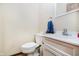 Convenient powder room with white vanity and commode at 450 W 250 N, Lebanon, IN 46052