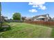Large backyard with fence is ready for outdoor activities at 452 Southern Pines Dr, Whiteland, IN 46184