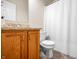 Bathroom featuring a light wood vanity, granite countertop, and white shower curtain at 452 Southern Pines Dr, Whiteland, IN 46184