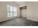 Bedroom featuring carpet, a window with blinds, and a built-in closet at 452 Southern Pines Dr, Whiteland, IN 46184