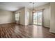 Cozy dining area featuring wood-look floors and modern pendant lighting at 452 Southern Pines Dr, Whiteland, IN 46184