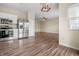 Open-concept kitchen with stainless steel appliances flows into a spacious living area at 452 Southern Pines Dr, Whiteland, IN 46184