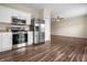 Modern kitchen with stainless steel appliances open to the living area at 452 Southern Pines Dr, Whiteland, IN 46184