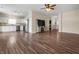 Spacious living area with wood-look flooring and seamless flow to the modern kitchen at 452 Southern Pines Dr, Whiteland, IN 46184