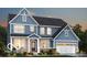 Charming two-story home featuring a two-car garage, and stylish blue siding and trim at 4955 Elaine Ct, Noblesville, IN 46062