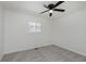 Bright bedroom features new carpeting, fresh paint, a ceiling fan, and plenty of natural light at 5134 Rinehart Ave, Indianapolis, IN 46241