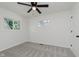 Bright bedroom featuring plush carpet, ceiling fan, and double windows at 5134 Rinehart Ave, Indianapolis, IN 46241