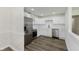 Modern kitchen boasts white cabinets, stainless steel appliances, and sleek countertops at 5134 Rinehart Ave, Indianapolis, IN 46241