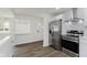 Modern kitchen boasts white cabinets, stainless steel appliances, and sleek countertops at 5134 Rinehart Ave, Indianapolis, IN 46241