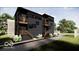 Modern two-story home with black siding, wooden accents, balconies, and professional landscaping at 517 Prospect St, Indianapolis, IN 46203