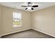 Relaxing bedroom with a scenic water view and a ceiling fan for added comfort at 5225 Thompson Park, Indianapolis, IN 46237