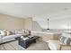 Cozy bonus room features neutral walls, modern decor and comfortable seating with an open view at 5225 Thompson Park, Indianapolis, IN 46237