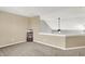 Open bonus room with neutral walls, carpet, and view of vaulted ceiling on second floor at 5225 Thompson Park, Indianapolis, IN 46237