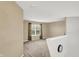 Bright bonus room with neutral walls, carpet and a large window with wooded view at 5225 Thompson Park, Indianapolis, IN 46237