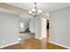 Open-concept dining room offering views of the entryway and living room, bright and inviting at 5225 Thompson Park, Indianapolis, IN 46237