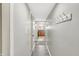 Inviting hallway with modern paint, coat hooks, and sightlines into kitchen at 5225 Thompson Park, Indianapolis, IN 46237
