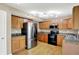 Spacious kitchen featuring wood cabinets and stainless steel appliances at 5225 Thompson Park, Indianapolis, IN 46237