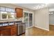 Bright kitchen with stainless steel dishwasher and a backyard view at 5225 Thompson Park, Indianapolis, IN 46237