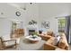 Comfortable living room has a modern fireplace and open access to dining area at 5225 Thompson Park, Indianapolis, IN 46237