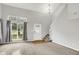 Bright living room features a soaring ceiling and large window allowing natural light to fill the space at 5225 Thompson Park, Indianapolis, IN 46237