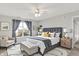 Beautifully furnished bedroom with a large bed, a window, and stylish decor at 5225 Thompson Park, Indianapolis, IN 46237