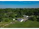 Aerial view of a residential property with lush landscaping and mature trees at 5387 E County Road 800 S, Mooresville, IN 46158