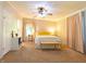 Comfortable bedroom with plush carpeting, ceiling fan, and serene color palette at 5387 E County Road 800 S, Mooresville, IN 46158