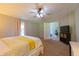 Relaxing bedroom with cozy carpeting, a ceiling fan, and a calming color scheme at 5387 E County Road 800 S, Mooresville, IN 46158
