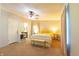 Bright bedroom with carpet, features ceiling fan, ensuite bathroom, and comfortable bed at 5387 E County Road 800 S, Mooresville, IN 46158