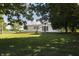 Charming home with a well-maintained front yard, lush green lawn, and mature trees providing ample shade at 5387 E County Road 800 S, Mooresville, IN 46158