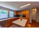 Traditional kitchen with light wood cabinets, speckled countertops, and a central island with fruit display at 5387 E County Road 800 S, Mooresville, IN 46158