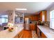 Bright kitchen features stainless steel appliances, light wood cabinetry, and a spacious island at 5387 E County Road 800 S, Mooresville, IN 46158