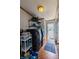 Functional laundry room with modern washer and dryer, storage shelves, and an exterior door for convenience at 5387 E County Road 800 S, Mooresville, IN 46158