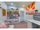 Bright office with shelving, large workspace, and decorative artwork, perfect for creativity and productivity at 5387 E County Road 800 S, Mooresville, IN 46158