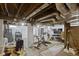 Finished basement area includes a washer, dryer, stationary bicycle, and exposed ductwork at 5715 Oak Ave, Indianapolis, IN 46219