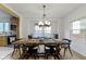 Bright dining room with a rustic wooden table and stylish light fixture at 5715 Oak Ave, Indianapolis, IN 46219