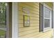 Welcome to Historic Irvington signage mounted on the home's yellow exterior at 5715 Oak Ave, Indianapolis, IN 46219