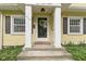 Close-up of the home's inviting front entrance, complete with charming details at 5715 Oak Ave, Indianapolis, IN 46219