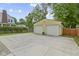 Detached two-car garage offers ample parking and storage space, complemented by a concrete driveway at 5715 Oak Ave, Indianapolis, IN 46219
