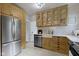 This kitchen features custom cabinets, subway tile backsplash, and stainless steel appliances at 5715 Oak Ave, Indianapolis, IN 46219